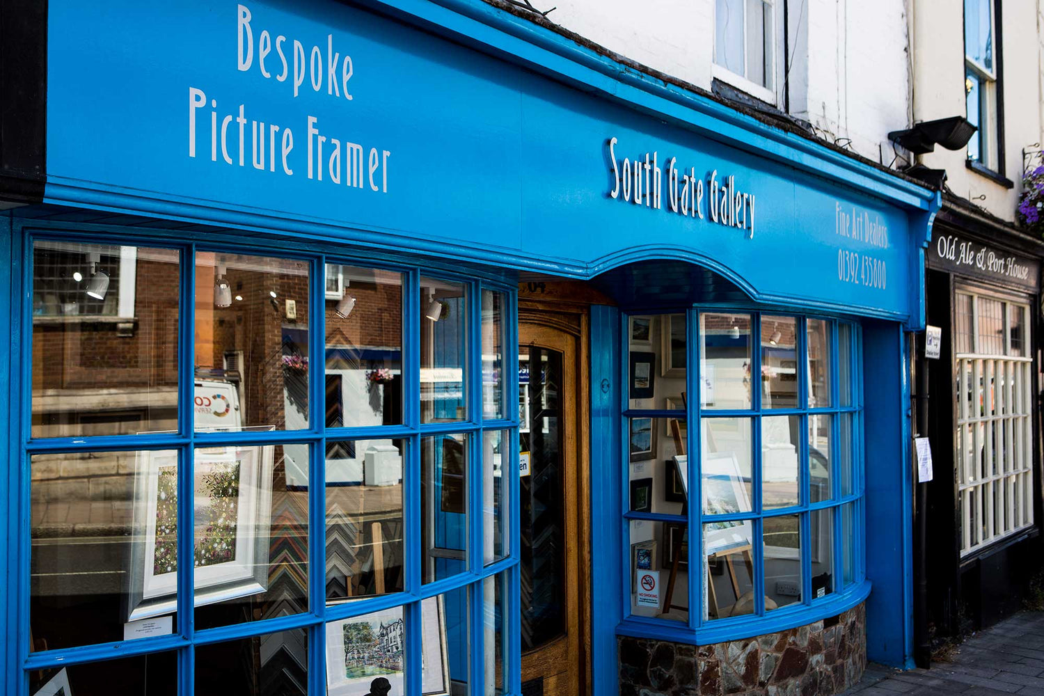The slate-grey shopfront of South Gate Gallery at 64 South Street in the Exeter cathedral quarter