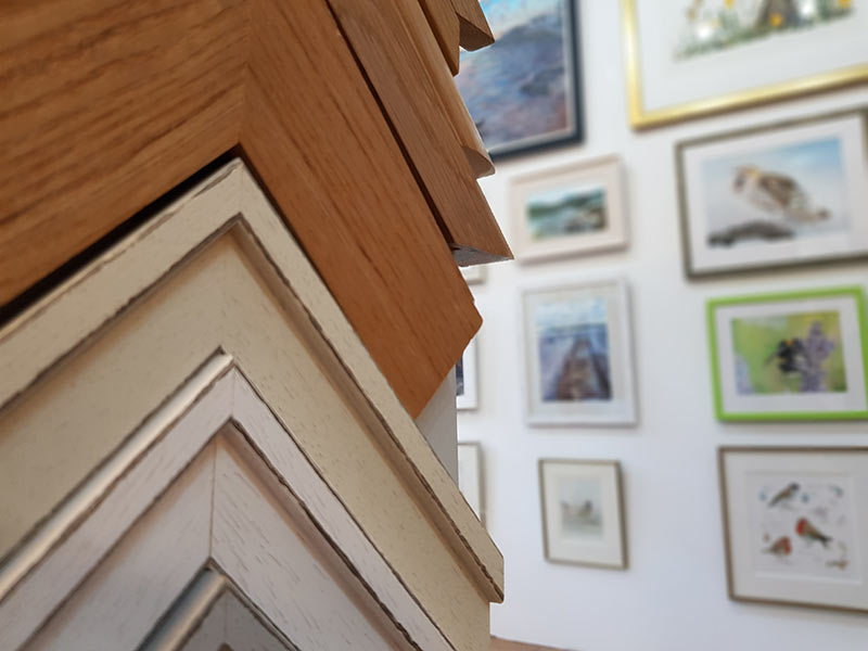 The picture-framing workshop bench at 64 South Street, with mouldings stacked against the wall
